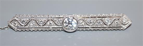 A modern 1920s style pierced 750 white metal and diamond set bar brooch, 58mm.